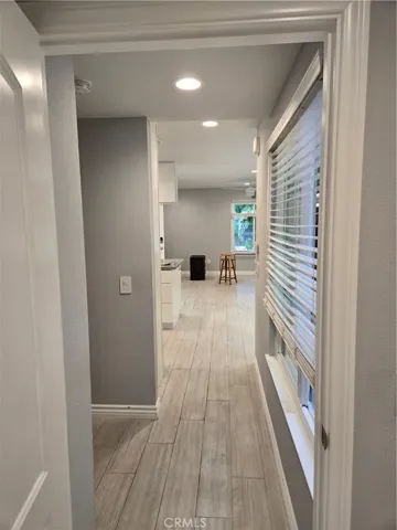 Hallway between bedrooms and living spaces from second bedroom