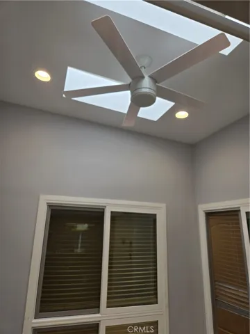 Custom ceiling in den/atrium with dynamic skylights, lighting and a fan