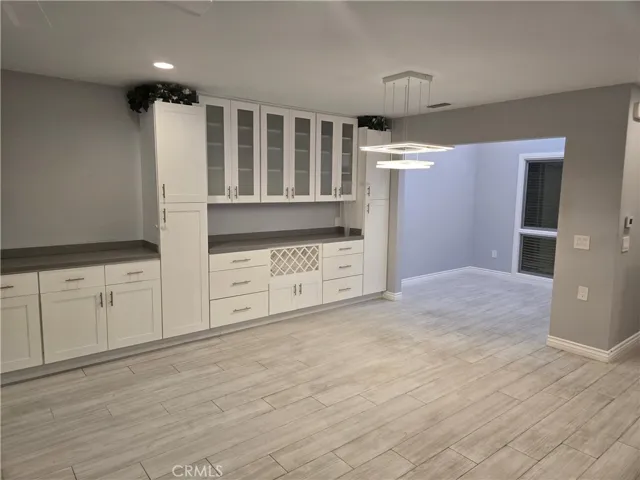 Dining area and den/atrium with nice built-ins