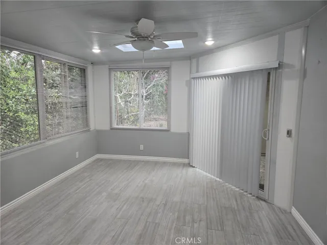 Custom/added space off master with lots of light, fan, skylight and its own outside/access slider with key