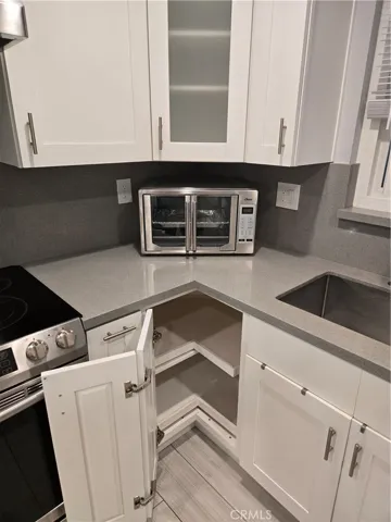 Custom storage in kitchen with included microwave