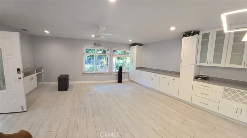 From kitchen to entry, living room, and dining area