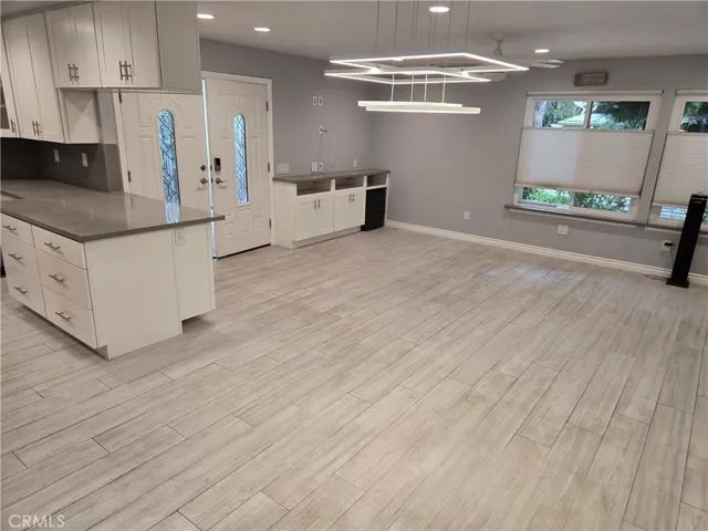 From den/atrium to dining and living areas, and kitchen