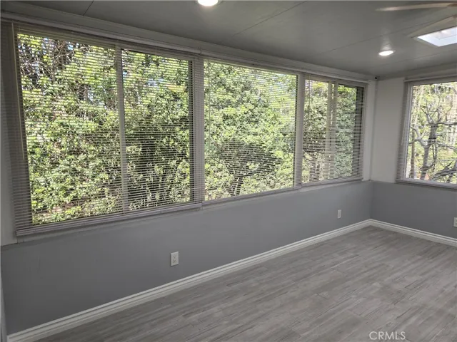 Added "room" using some patio space. GREAT for office, recreation room, sun room, or to view the landscape. Access from master OR private slider to patio!