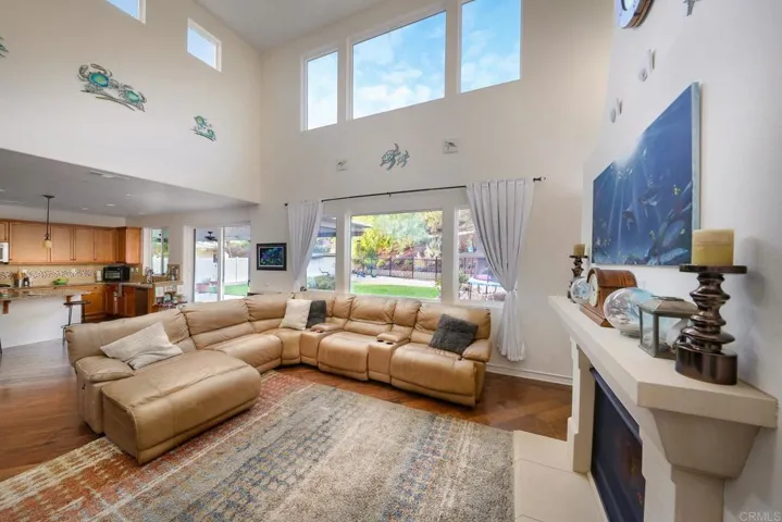 Soaring Ceilings and picture windows in the Living room lets in natural light all day long.