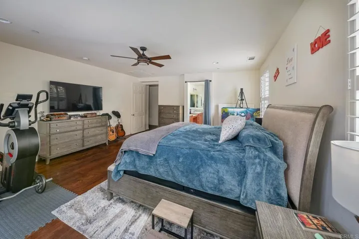 Primary suite has access to backyard covered patio.