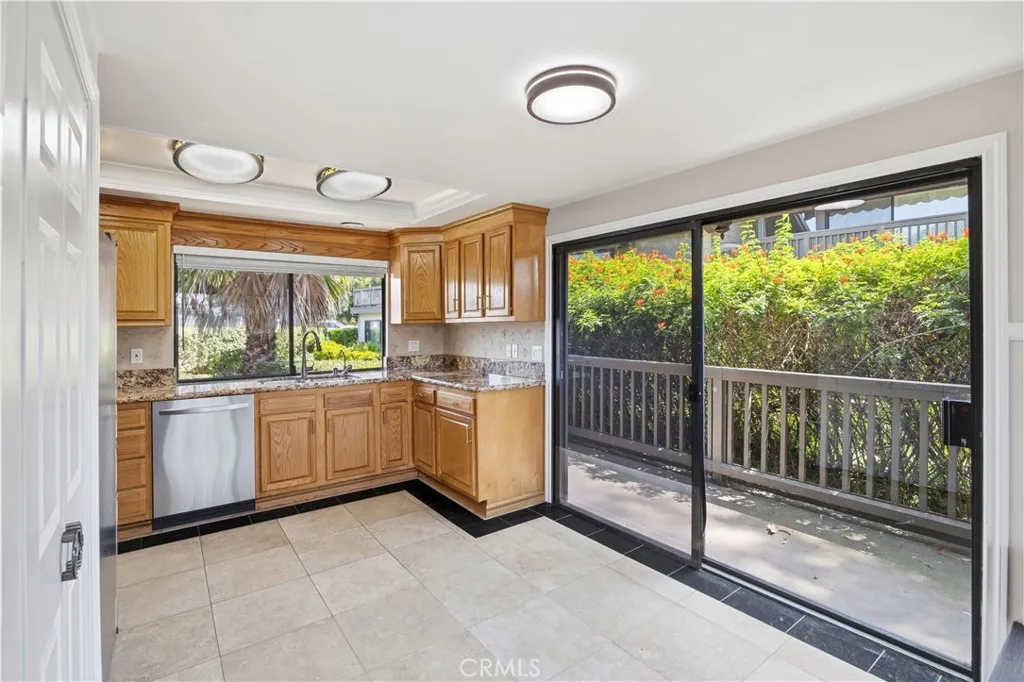 The breakfast nook with brand-new ceiling light. It is next to the third set of sliding door leading to the second balcony since it is the end-unit.