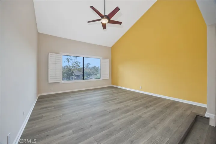 The yellow wall is  gone. The entire primary bedroom has the same color paint as in the picture with virtual staging.