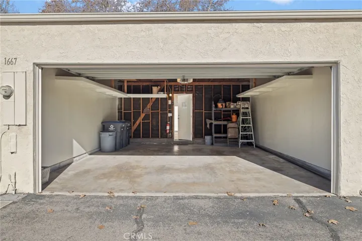 2 car garage with shelf space