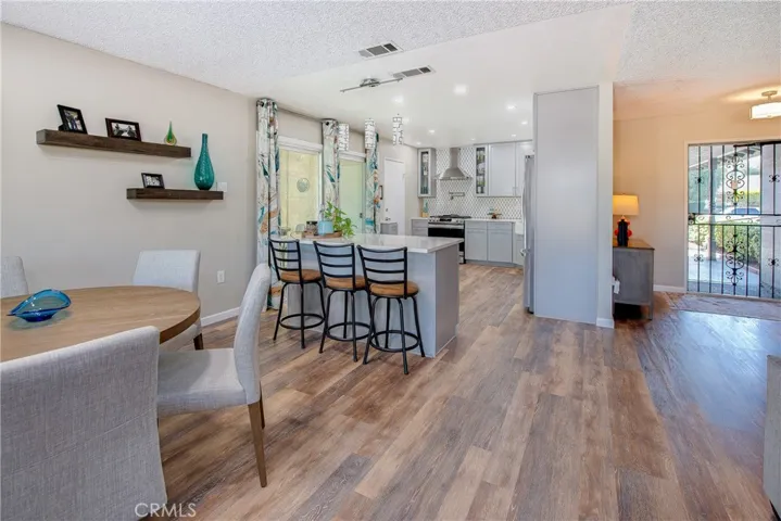 Extraordinary high, high quality remodeled kitchen with quartz countertops, specially designed backsplashes to the ceiling, premium appliances, custom cabinets galore and fabulous island breakfast bar.