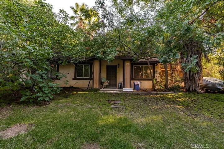 The second house is set apart from the main house.