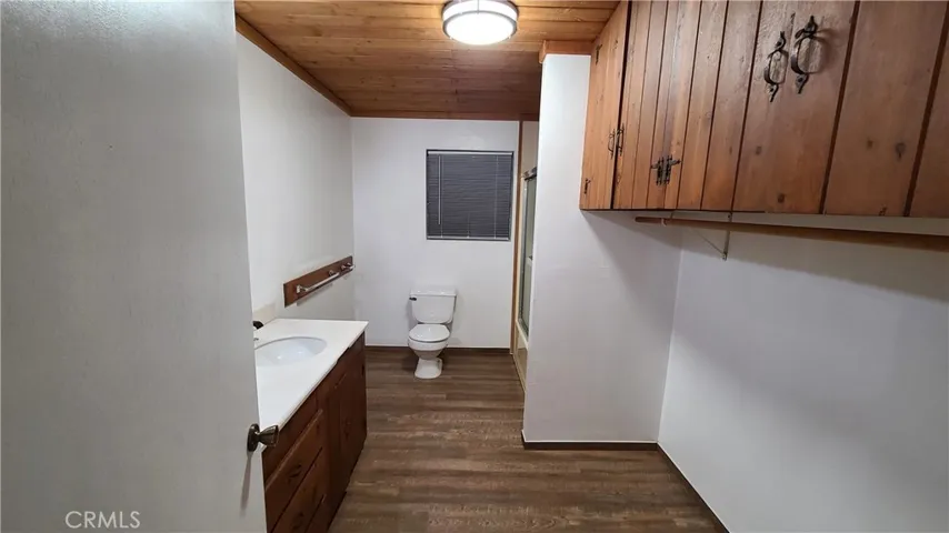 Unit B Upstairs bathroom with tub, shower, and dual sinks.