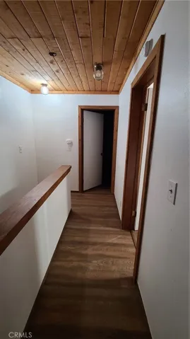 Unit B Hallway between bedrooms. Bathroom on the right.
