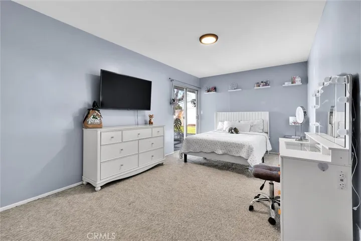 bedroom two with access to the backyard.