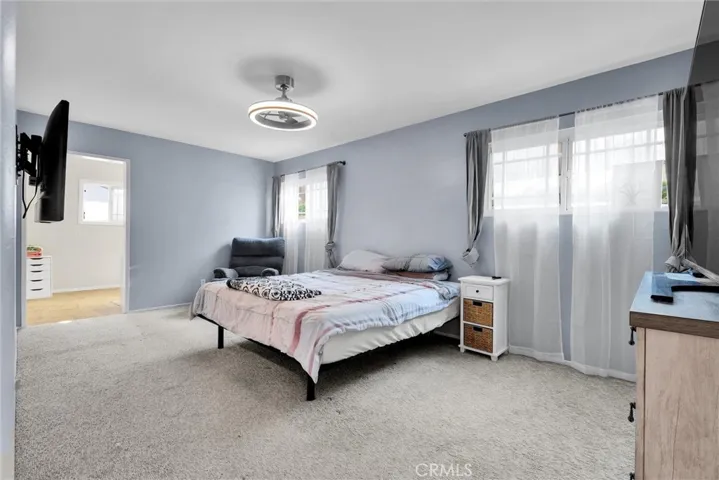 Large Primary bedroom with room for a king size bed two windows for lots of natural light.