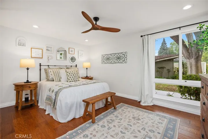 Primary bedroom with recessed lighting and ceiling fan