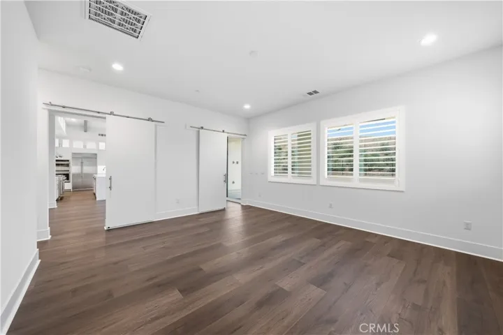 Family room with two barn doors to close off from great room