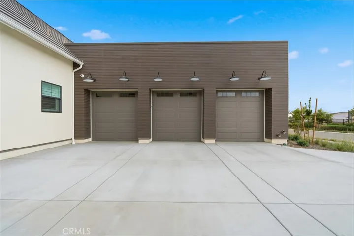 Large 3 car garage with tall doors
