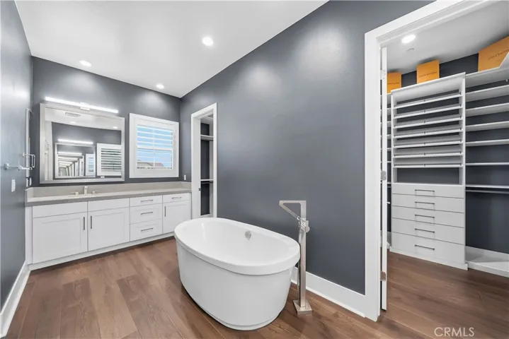 En Suite with two custom built 9ft tall walk in closets