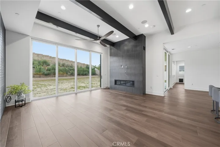 60" gas linear fireplace with matching textured finish to wall in great room