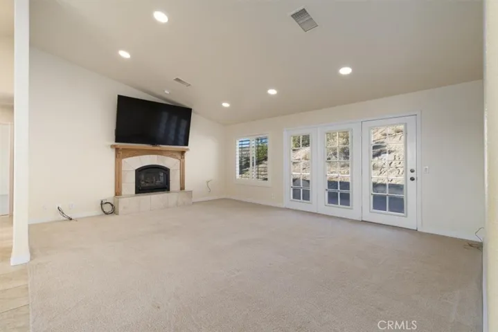 Gas fireplace, custom tv mount, backyard doorway