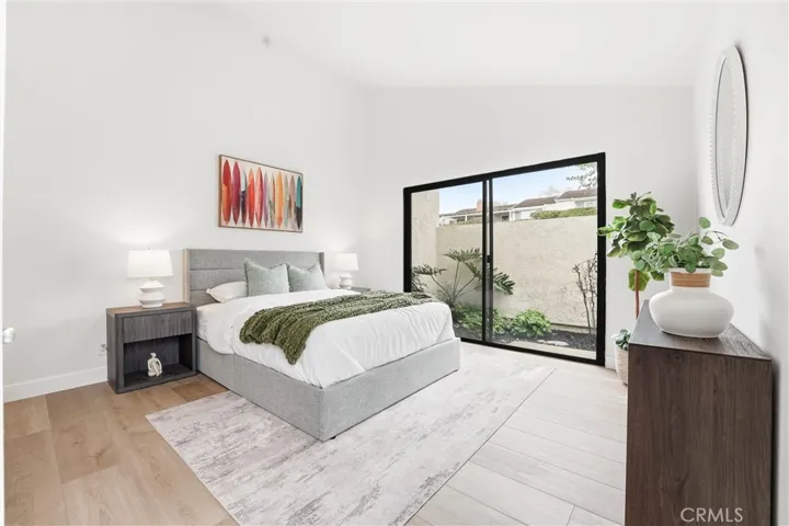 Spacious guest bedroom is light and bright and has its own access to the large private courtyard.