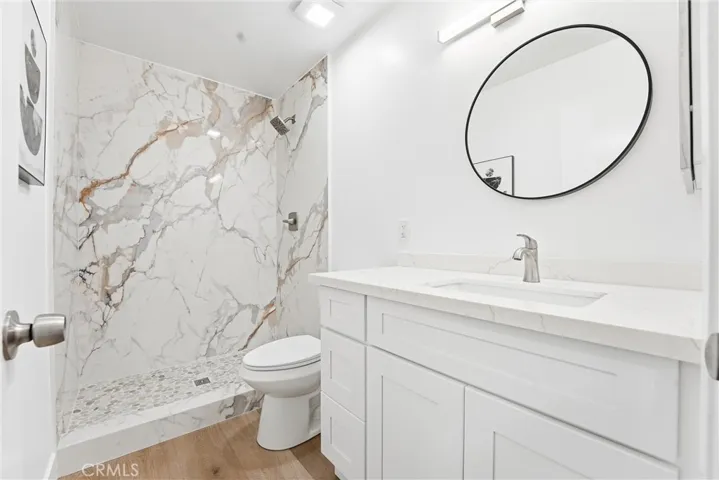 Secondary bath.  New glass shower door has been added.