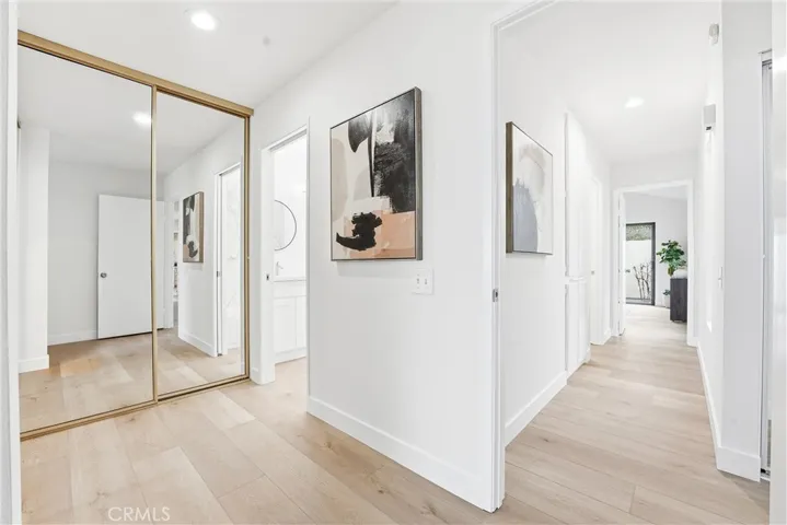 A well-designed dressing area with dual closets adds convenience and storage to the primary bedroom.