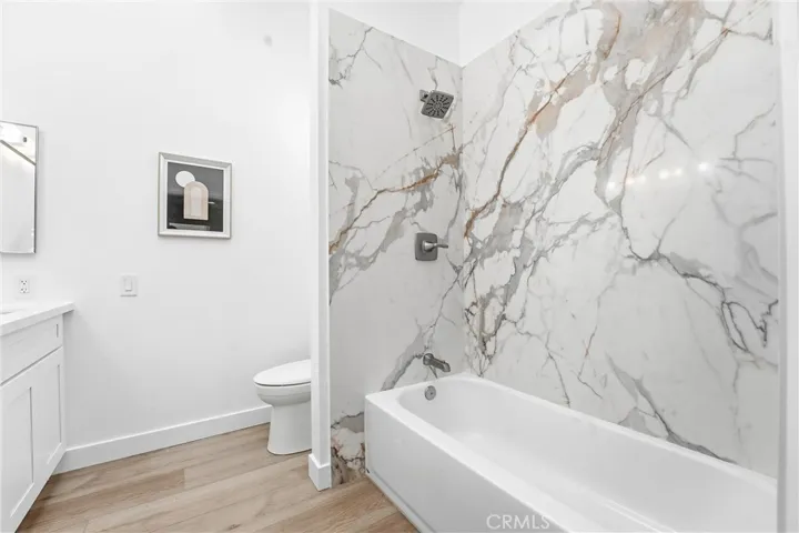 A completely new primary shower with quartz surround, finished with glass shower doors added after for a clean, contemporary feel.