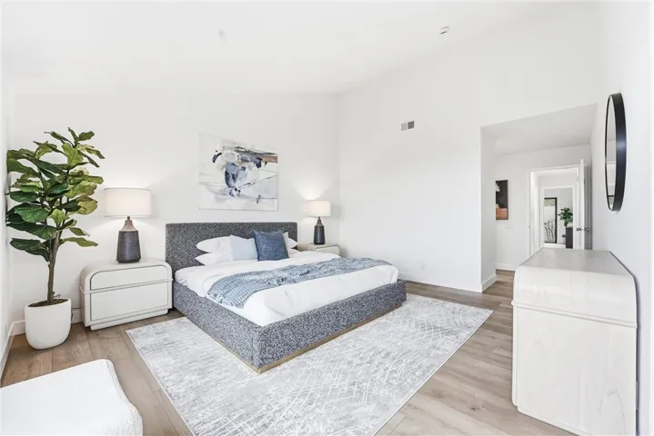 The primary bedroom is spacious and bright, with ocean views that create a peaceful, coastal ambiance