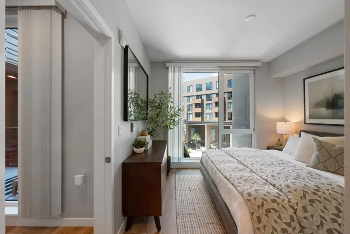 Bedroom featuring wood finished floors and baseboards
