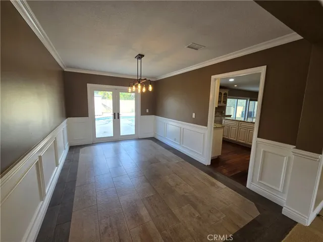 Dining room has a slider to the backyard and a door that leads to the kitchen.