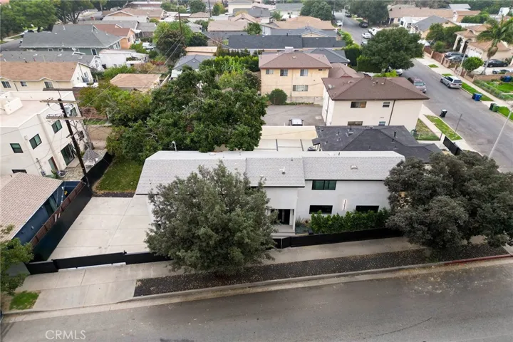 2225 Shoredale. Gated parking and garage to the left of the image.