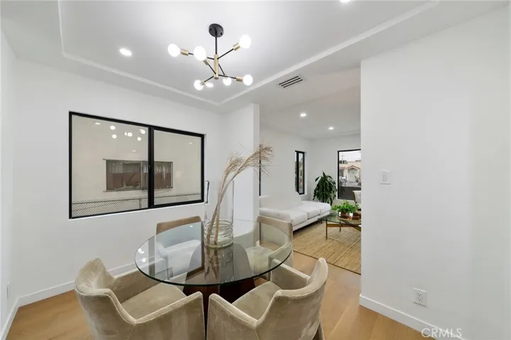 2229 Shoredale updated dining situated between living and kitchen and has a built in cabinet on the opposite side. See next image.