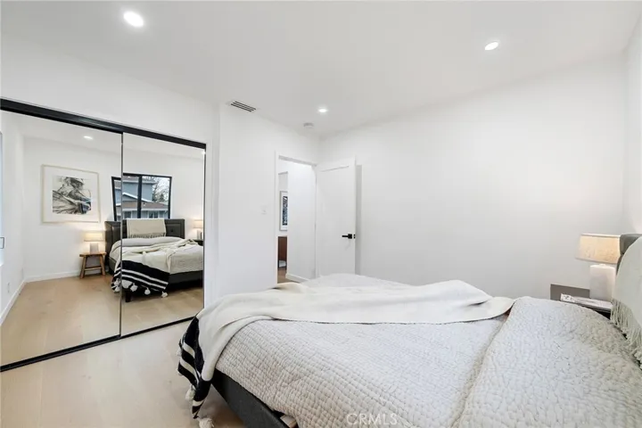 2229 Shoredale updated front bedroom is roomy with mirrored closet doors.