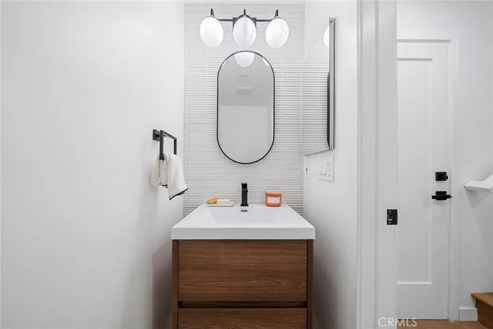 2225 Shoredale Powder room near garage door and stairs to bedrooms and remaining bathrooms.