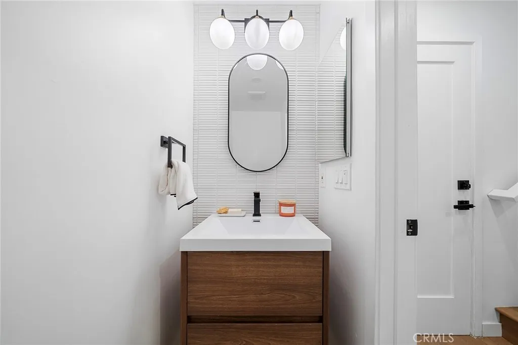 53 / 622225 Shoredale Powder room near garage door and stairs to bedrooms and remaining bathrooms.