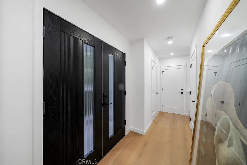 2225 Shoredale Entry. Straight ahead is the powder room right before the garage door and stairs to the bedrooms and upstairs bathrooms.
