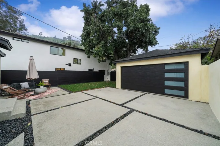 Spacious area to entertain. 2225 Shoredale (sold together with 2229) is seen in the distance (painted white) Both units are fenced off from one another for privacy and both have two car garages and gated access.