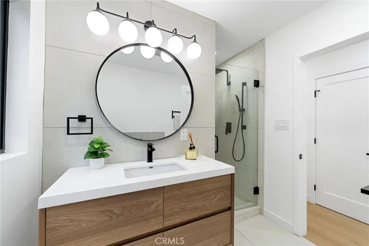 2229 Shoredale updated bathroom with a tub and separate shower to invite you to soak in.