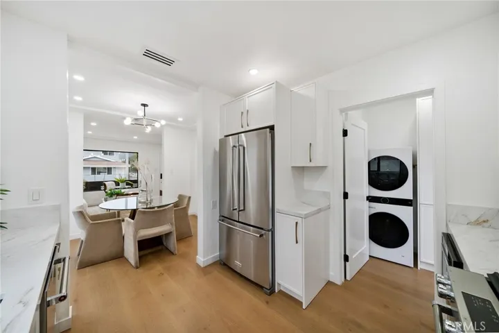 2229 Shoredale roomy and updated elegant kitchen with laundry in the distance near the exit to the backyard. Dining room between kitchen and living room. You can see the living room from the kitchen.