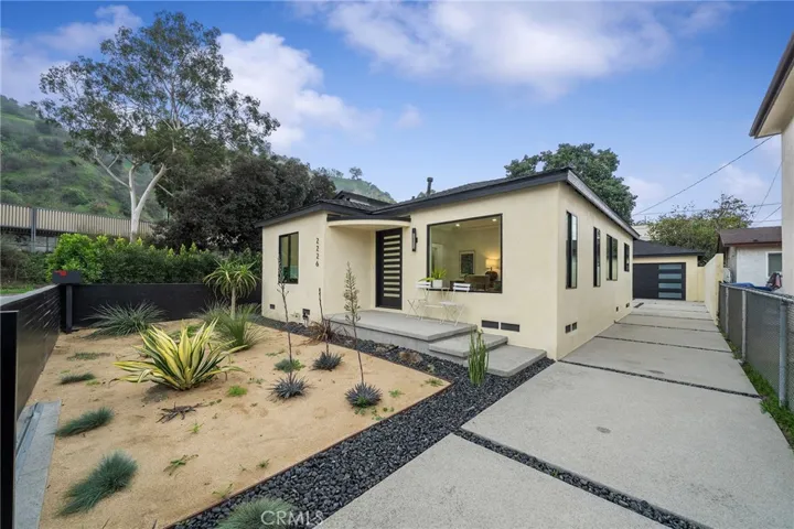 2229 Shoredale with long driveway to the 2 car garage. All beautifully updated for you and sold with 2225 Shoredale.