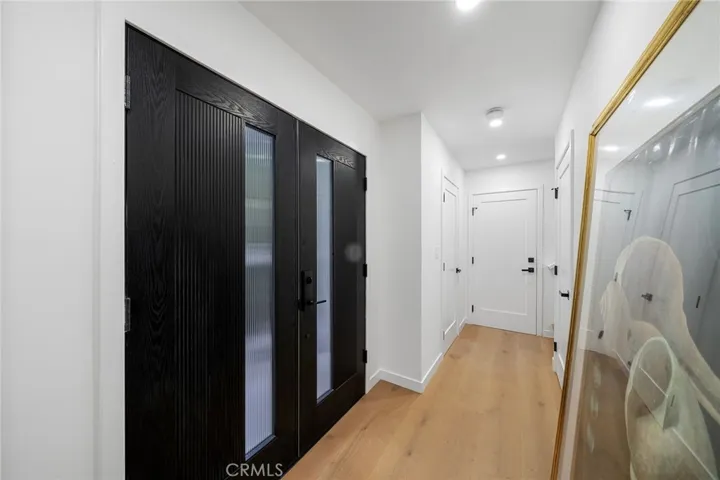 2225 Shoredale Entry. Straight ahead is the powder room right before the garage door and stairs to the bedrooms and upstairs bathrooms.