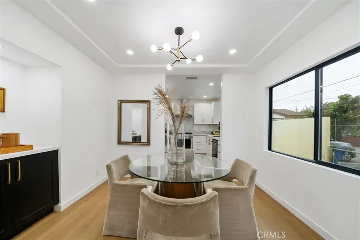 2229 Shoredale updated dining situated between living and kitchen and has a built in cabinet on the opposite side. See next image.