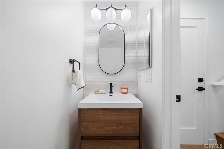 53 / 622225 Shoredale Powder room near garage door and stairs to bedrooms and remaining bathrooms.