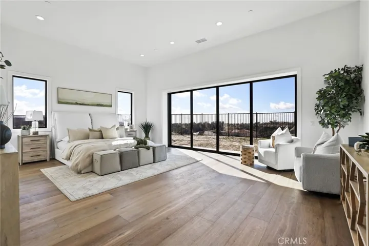 Huge Primary bedroom with doors to backyard and view