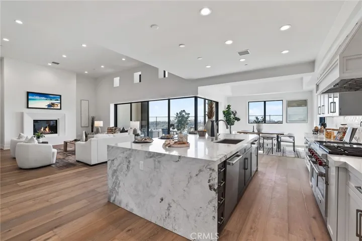 Gourmet kitchen with two tone cabinets, waterfall island