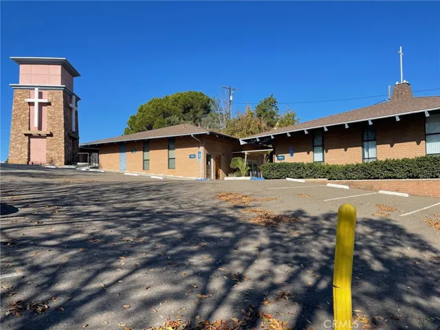 Two of the main buildings plus the cellphone tower at the Subject Property.  The Sanctuary is not visible from this photo and is located behind the tower.