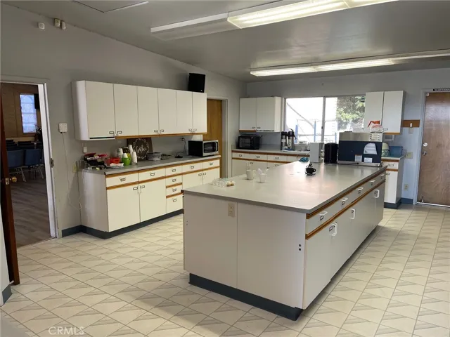 Looking Northwest into the institutional-style kitchen.  The door on the left side of this photo enters into the Sanctuary.