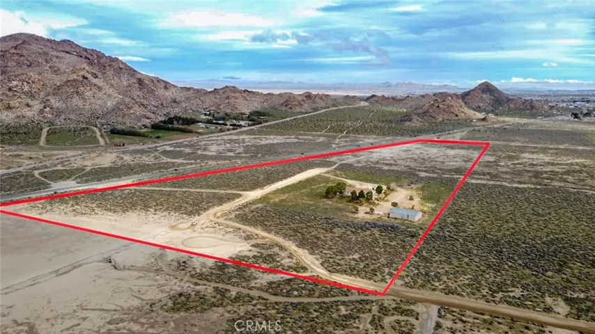 28.64 acres - 2,280 sq ft home - 2,400 sq ft airplane hangar/shop - Private well  - Hwy 18 frontage - Western Lucerne Valley